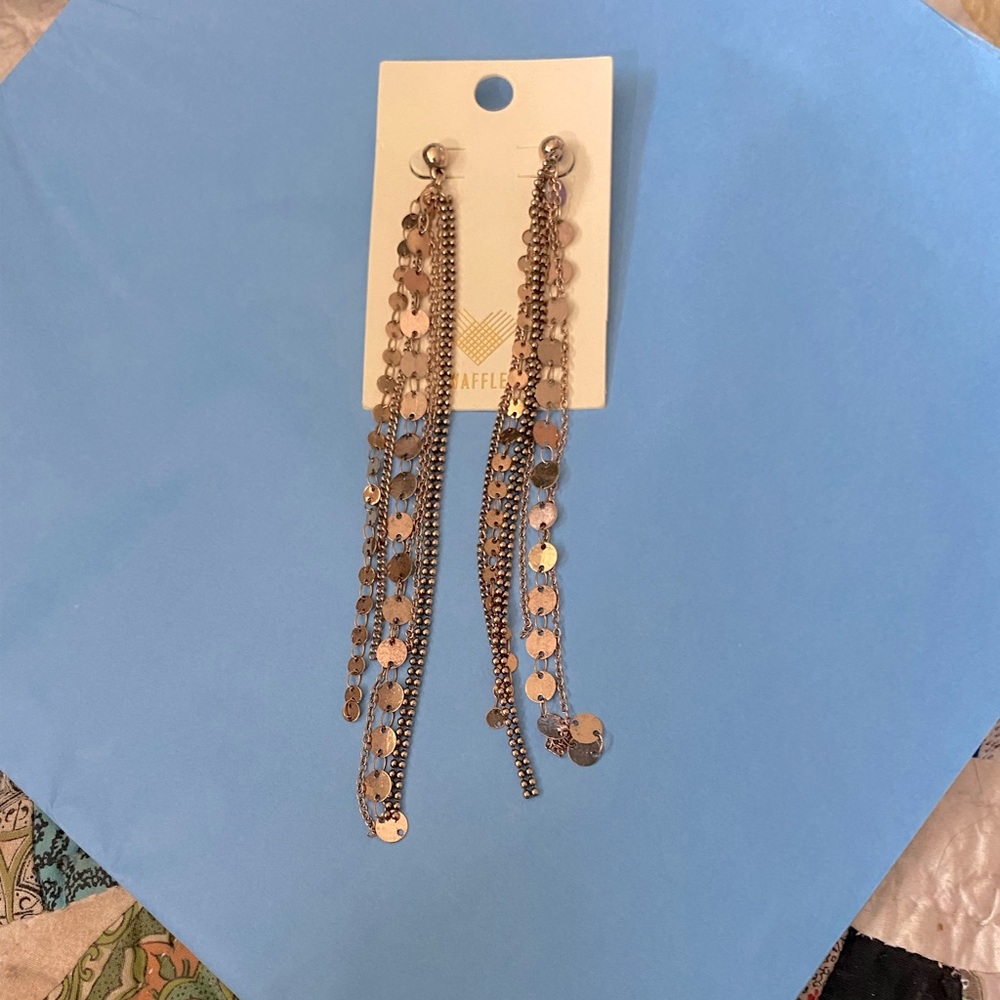 Woman’s gold earrings